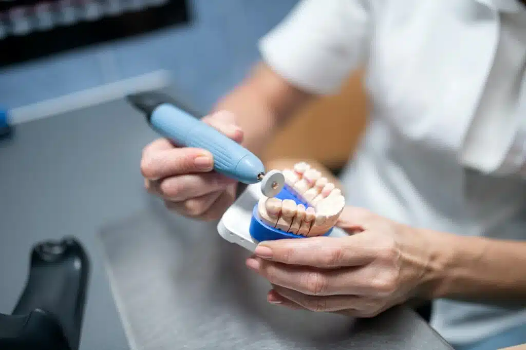 Dental prosthesis in hands of dental technician